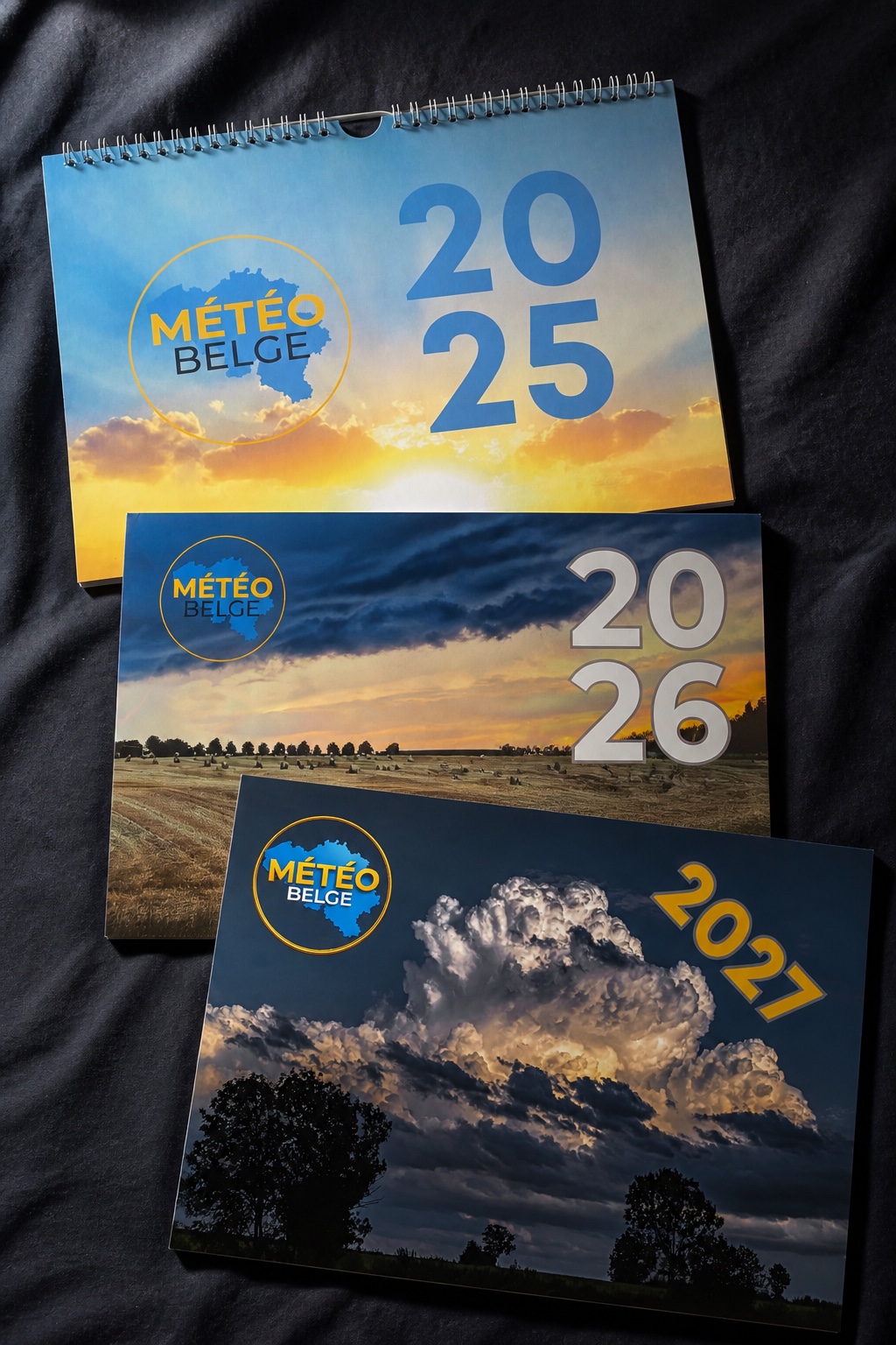 Les trois éditions du calendrier Météo Belge 2025, 2026 et 2027
